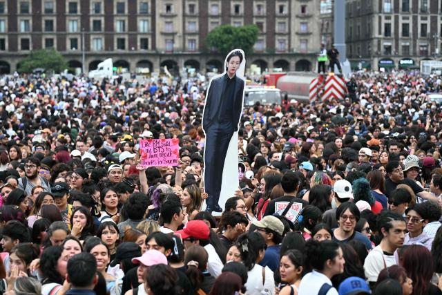 Fans of South Korean K-pop band BTS gather outside the National Palace waiting for the band members to appear on the balcony, at Zocalo square in Mexico City on May 6, 2026. BTS will hold three sold-out shows at Estadio GNP Seguros in Mexico city on May 7, 9, and 10. (Photo by YURI CORTEZ / AFP)