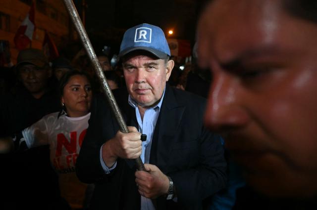 Peru's presidential candidate for the Renovacion Popular party, Rafael Lopez Aliaga, attends a rally to demand respect for the recent elections in Lima on May 6, 2026. (Photo by ERNESTO BENAVIDES / AFP)