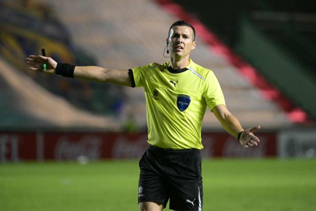 Uruguayan referee Andres Matonte gestures during the Copa Sudamericana group stage football match between Argentina's Barracas Central and Paraguay's Olimpia at the Florencio Sola stadium in Banfield, Buenos Aires province, Argentina on May 6, 2026. (Photo by Juan MABROMATA / AFP)
