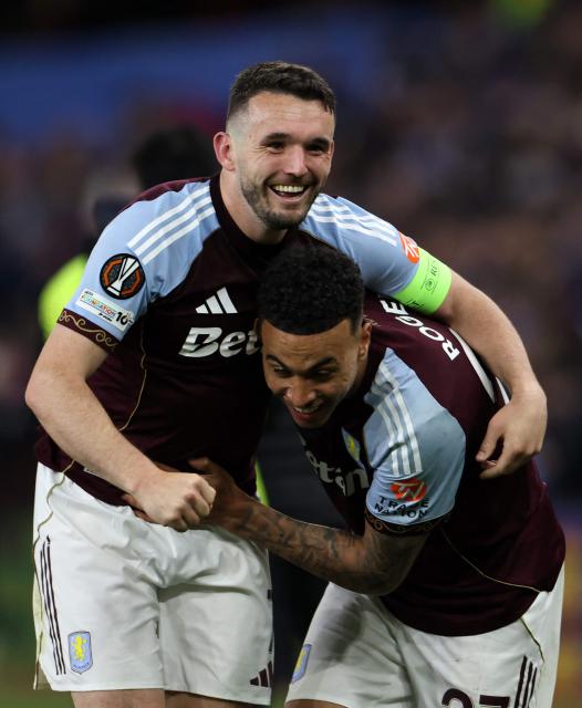 Aston Villa's Scottish midfielder  #07 John McGinn celebrates with Aston Villa's English midfielder #27 Morgan Rogers after the UEFA Europa League, semi-final second-leg football match between Aston Villa and Nottingham Forest at Villa Park in Birmingham, central England on May 7, 2026. Aston Villa won the match 4-0. (Photo by Darren Staples / AFP)