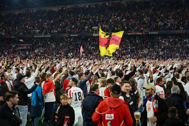 SC Freiburg's fans celebrate on the pitch after Freiburg's 3-1 win in the UEFA Europa League semi-final second leg football match between SC Freiburg and SC Braga in Freiburg im Breisgau, southwestern Germany on May 7, 2026. Lukas Kuebler scored in each half as Freiburg beat Braga 3-1 at home on May 7 to win 4-3 on aggregate and and qualify for the Europa League final where they will face Aston Villa. (Photo by Silas STEIN / AFP)