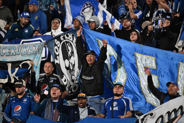 Fans of Millonarios cheer for their team ahead of the Copa Sudamericana group stage football match between Uruguay's Boston River and Colombia's Millonarios at the Centenario stadium in Montevideo on May 7, 2026. (Photo by Eitan ABRAMOVICH / AFP)