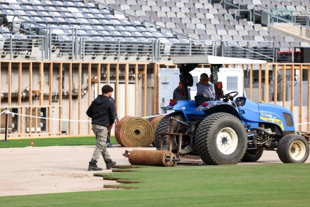 Workers install the pitch at New York New Jersey Stadium (temporarily renamed from MetLife stadium) ahead of the 2026 FIFA World Cup, in East Rutherford, New Jersey on May 7, 2026. (Photo by CHARLY TRIBALLEAU / AFP)