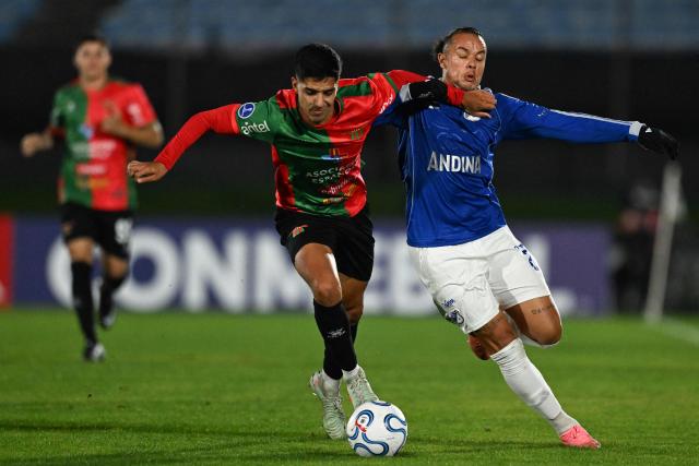 Boston River's defender #3 Marco Mancebo (L) and Millonarios' forward #23 Leonardo Castro fight for the ball during the Copa Sudamericana group stage football match between Uruguay's Boston River and Colombia's Millonarios at the Centenario stadium in Montevideo on May 7, 2026. (Photo by Eitan ABRAMOVICH / AFP)