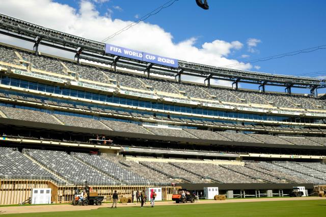 Workers install the pitch at New York New Jersey Stadium (temporarily renamed from MetLife stadium) ahead of the 2026 FIFA World Cup, in East Rutherford, New Jersey on May 7, 2026. (Photo by CHARLY TRIBALLEAU / AFP)