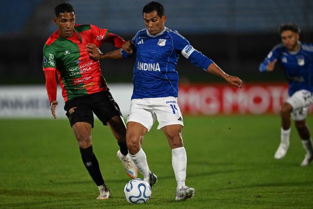 Boston River's Venezuelan midfielder #6 Andres Romero and Millonarios' midfielder #14 David Silva fight for the ball during the Copa Sudamericana group stage football match between Uruguay's Boston River and Colombia's Millonarios at the Centenario stadium in Montevideo on May 7, 2026. (Photo by Eitan ABRAMOVICH / AFP)