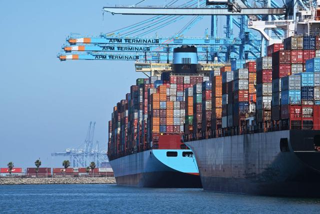 (FILES) Container ships are docked at the APM Terminal at the Port of Los Angeles, California, on July 31, 2025. A US trade court on Thursday dealt President Donald Trump a fresh setback, ruling against the 10-percent global tariffs he instituted after the Supreme Court struck down many earlier duties. (Photo by Robyn Beck / AFP)