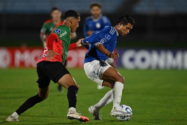 Boston River's Venezuelan midfielder #6 Andres Romero (L) and Millonarios' midfielder #14 David Silva fight for the ball during the Copa Sudamericana group stage football match between Uruguay's Boston River and Colombia's Millonarios at the Centenario stadium in Montevideo on May 7, 2026. (Photo by Eitan ABRAMOVICH / AFP)
