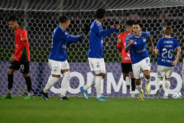 Millonarios' Argentine forward #27 Rodrigo Contreras celebrates with teammates after scoring a penalty during the Copa Sudamericana group stage football match between Uruguay's Boston River and Colombia's Millonarios at the Centenario stadium in Montevideo on May 7, 2026. (Photo by Eitan ABRAMOVICH / AFP)