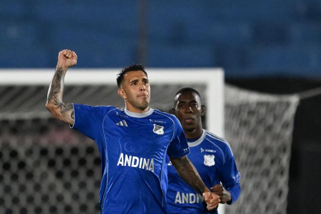 Millonarios' Argentine forward #27 Rodrigo Contreras (L) celebrates after scoring a penalty during the Copa Sudamericana group stage football match between Uruguay's Boston River and Colombia's Millonarios at the Centenario stadium in Montevideo on May 7, 2026. (Photo by Eitan ABRAMOVICH / AFP)