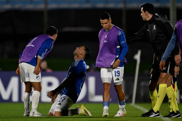 Millonarios' Argentine forward #27 Rodrigo Contreras (C) celebrates with teammates after scoring his team's third goal during the Copa Sudamericana group stage football match between Uruguay's Boston River and Colombia's Millonarios at the Centenario stadium in Montevideo on May 7, 2026. (Photo by Eitan ABRAMOVICH / AFP)