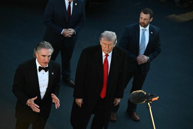 US Secretary of the Interior Doug Burgum speaks while US President Donald Trump and US Secretary of Homeland Security Markwayne Mullin listen, at the Lincoln Memorial Reflecting Pool in Washington, DC, on May 7, 2026. Workers have been resurfacing the bottom of Washington's famous Lincoln Memorial Reflecting Pool with "American flag blue"-colored material used in swimming pools, following an order by US President Donald Trump. (Photo by Kent NISHIMURA / AFP)