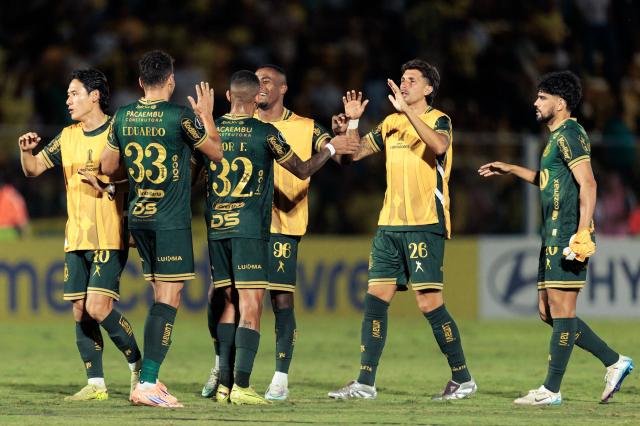 MIrassol players celebrate at the end of the Copa Libertadores group stage football match between Brazil's Mirassol and Ecuador's Liga de Quito at the Jose Maria de Campos Maia stadium in Mirassol, state of Sao Paulo, Brazil on May 7, 2026. (Photo by RAPHA MARQUES / AFP)