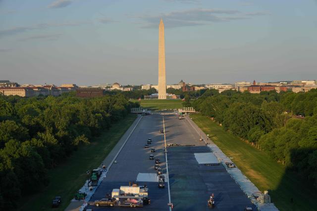 The motorcade with US President Donald Trump drives in the Lincoln Memorial Reflecting Pool during a visit to see the new blue protective coating being applied as part of a renovation project, in Washington, DC, on May 7, 2026. Workers have been resurfacing the bottom of Washington's famous Lincoln Memorial Reflecting Pool with "American flag blue"-colored material used in swimming pools, following an order by US President Donald Trump. (Photo by Alex Brandon / POOL / AFP)