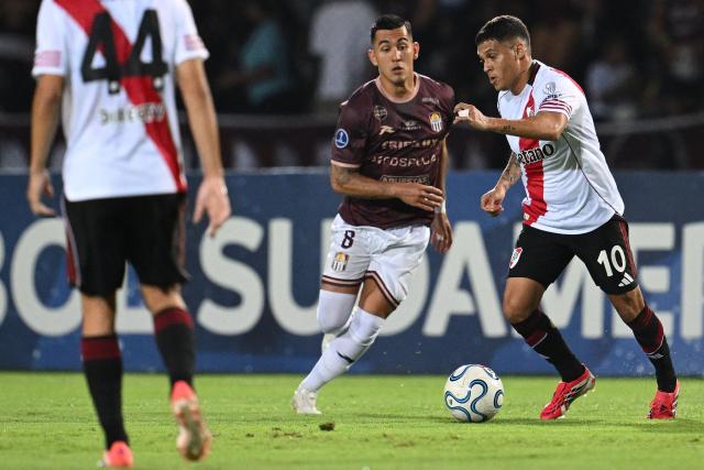 Carabobo's midfielder #08 Juan Camilo Perez and River Plate's Colombian midfielder #10 Juan Fernando Quintero fight for the ball during the Copa Sudamericana group stage football match between Venezuela's Carabobo FC and Argentina's River Plate at the Misael Delgado stadium in Valencia, Carabobo state, Venezuela on May 7, 2026. (Photo by Federico PARRA / AFP)