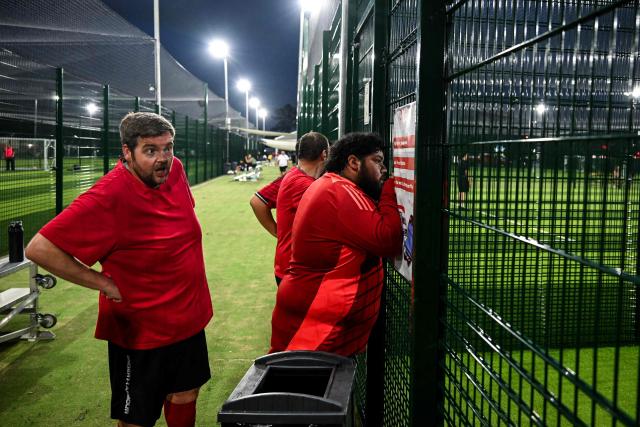Participants in the “Man vs Fat Soccer” weight-loss program play a soccer game, in Houston, Texas on May 5, 2026. In a soccer league of big men trying to lose weight, the five-a-side teams feature names like OB City, Big Bananas and Heavy Touch FC. And players can score before the game even starts, standing on a scale and winning goal points for chipping away at their weight problems. Welcome to Man vs. Fat Soccer, a tongue in cheek Texas league that is thriving as Houston prepares to join cities elsewhere in the United States in hosting World Cup games, along with Mexico and Canada. (Photo by RONALDO SCHEMIDT / AFP)
