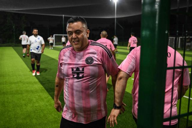 Participants in the “Man vs Fat Soccer” weight-loss program play a soccer game, in Houston, Texas on May 5, 2026. In a soccer league of big men trying to lose weight, the five-a-side teams feature names like OB City, Big Bananas and Heavy Touch FC. And players can score before the game even starts, standing on a scale and winning goal points for chipping away at their weight problems. Welcome to Man vs. Fat Soccer, a tongue in cheek Texas league that is thriving as Houston prepares to join cities elsewhere in the United States in hosting World Cup games, along with Mexico and Canada. (Photo by RONALDO SCHEMIDT / AFP)