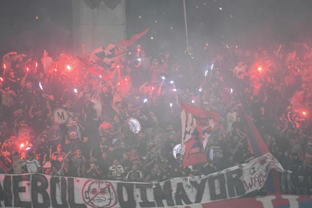 Medellin fans set off flares as they cheer during the Copa Libertadores group stage football match between Colombia's Independiente Medellin and Brazil's Flamengo at the Atanasio Girardot stadium in Medellin, Antioquia department, Colombia on May 7, 2026. (Photo by Jaime SALDARRIAGA / AFP)