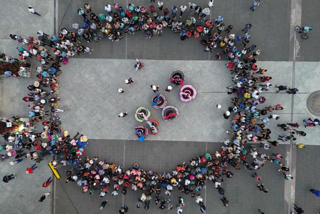 This aerial view shows a folkloric dance performance at Gerardo Barrios Central Square in the historic center of San Salvador, El Salvador, on May 7, 2026. (Photo by Marvin RECINOS / AFP)