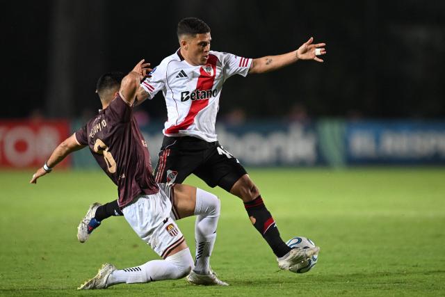 Carabobo's midfielder #08 Juan Camilo Perez and River Plate's Colombian midfielder #10 Juan Fernando Quintero fight for the ball during the Copa Sudamericana group stage football match between Venezuela's Carabobo FC and Argentina's River Plate at the Misael Delgado stadium in Valencia, Carabobo state, Venezuela on May 7, 2026. (Photo by Federico PARRA / AFP)