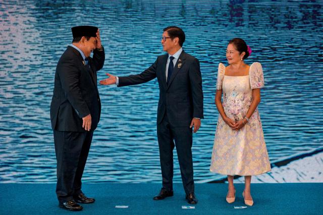 Indonesian President Prabowo Subianto (L) is greeted by Philippine President Ferdinand Marcos Jr. and his wife Liza Araneta Marcos during a welcome ceremony for the 48th Association of Southeast Asian Nations (ASEAN) summit in Cebu, central Philippines on May 7, 2026. (Photo by Ezra Acayan / POOL / AFP)