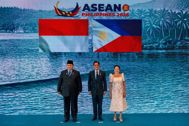 Indonesian President Prabowo Subianto (L) poses for a photo with Philippine President Ferdinand Marcos Jr. and his wife Liza Araneta Marcos during a welcome ceremony for the 48th Association of Southeast Asian Nations (ASEAN) summit in Cebu, central Philippines on May 7, 2026. (Photo by Ezra Acayan / POOL / AFP)