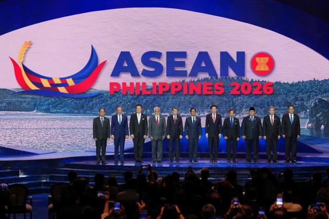 (L-R) Myanmar's Permanent Secretary of the Ministry of Foreign Affairs U Hau Khan Sum, Malaysia's Prime Minister Anwar Ibrahim, Thailand's Prime Minister Anutin Charnvirakul, East Timor's Prime Minister Xanana Gusmao, Vietnam's Prime Minister Le Minh Hung, Philippine President Ferdinand Marcos Jr., Singapore's Prime Minister Lawrence Wong, Brunei's Sultan Hassanal Bolkiah, Indonesia's President Prabowo Subianto, Cambodia's Prime Minister Hun Manet and Laos Prime Minister Sonexay Siphandone pose for a group photo during the opening ceremony of the 48th Association of Southeast Asian Nations (ASEAN) summit in Cebu, central Philippines on May 8, 2026. (Photo by Aaron FAVILA / POOL / AFP)