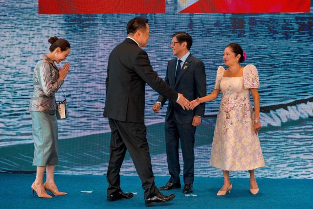 Thailand Prime Minister Anutin Charnvirakul (2nd-L) and his wife Thananon Niramit are greeted by Philippine President Ferdinand Marcos Jr. and his wife Liza Araneta Marcos during a welcome ceremony for the 48th Association of Southeast Asian Nations (ASEAN) summit in Cebu, central Philippines on May 8, 2026. (Photo by Ezra Acayan / POOL / AFP)
