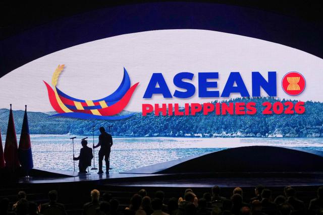 Workers arrange microphones on the stage before the start of the opening ceremony during the 48th Association of Southeast Asian Nations (ASEAN) summit in Cebu, central Philippines on May 8, 2026. (Photo by Aaron FAVILA / POOL / AFP)