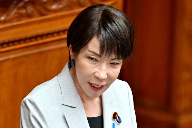 Japan's Prime Minister Sanae Takaichi answers questions regarding the bill to establish the National Intelligence Council during a House of Councillors plenary session at the parliament in Tokyo on May 8, 2026. (Photo by Kazuhiro NOGI / AFP)