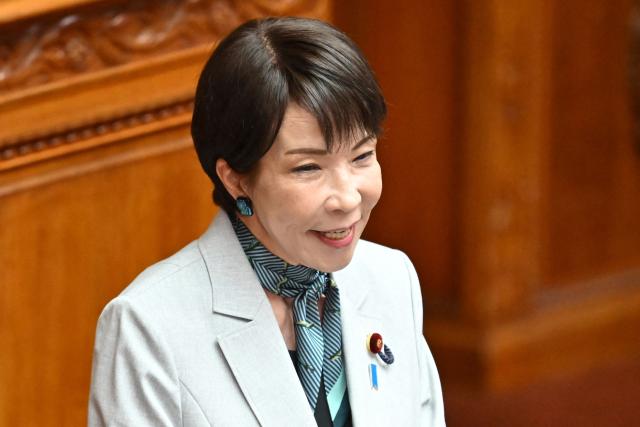 Japan's Prime Minister Sanae Takaichi answers questions regarding the bill to establish the National Intelligence Council during a House of Councillors plenary session at the parliament in Tokyo on May 8, 2026. (Photo by Kazuhiro NOGI / AFP)