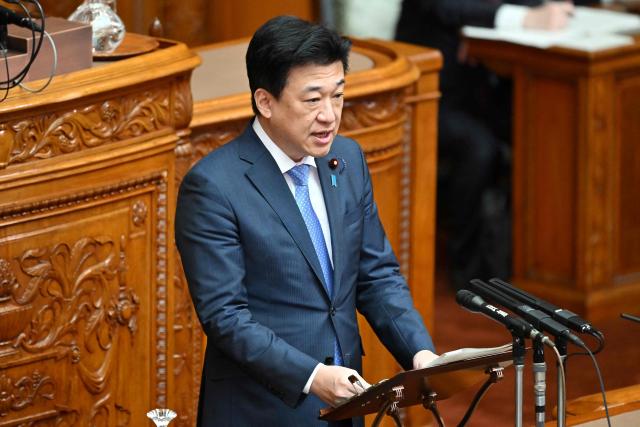 Chief Cabinet Secretary Minoru Kihara explains the purpose of the bill to establish the National Intelligence Council in the House of Councillors plenary session at parliament in Tokyo on May 8, 2026. (Photo by Kazuhiro NOGI / AFP)