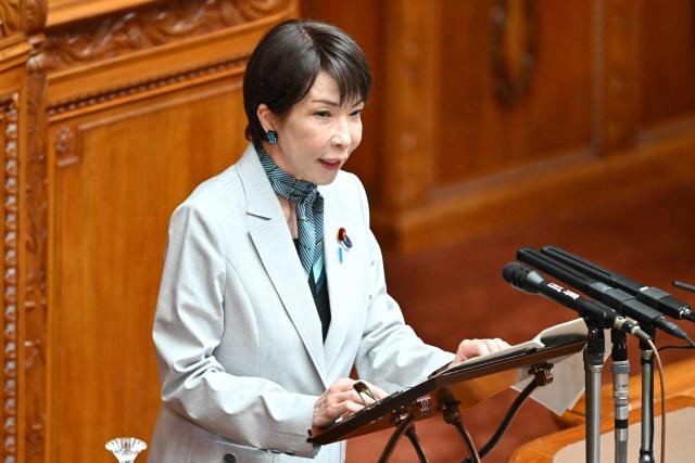 Japan's Prime Minister Sanae Takaichi answers questions regarding the bill to establish the National Intelligence Council during a House of Councillors plenary session at the parliament in Tokyo on May 8, 2026. (Photo by Kazuhiro NOGI / AFP)