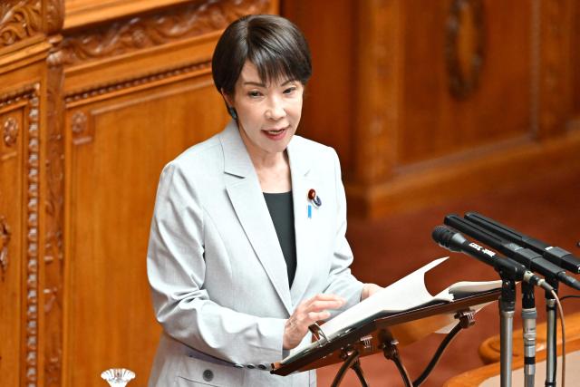 Japan's Prime Minister Sanae Takaichi answers questions regarding the bill to establish the National Intelligence Council during a House of Councillors plenary session at the parliament in Tokyo on May 8, 2026. (Photo by Kazuhiro NOGI / AFP)