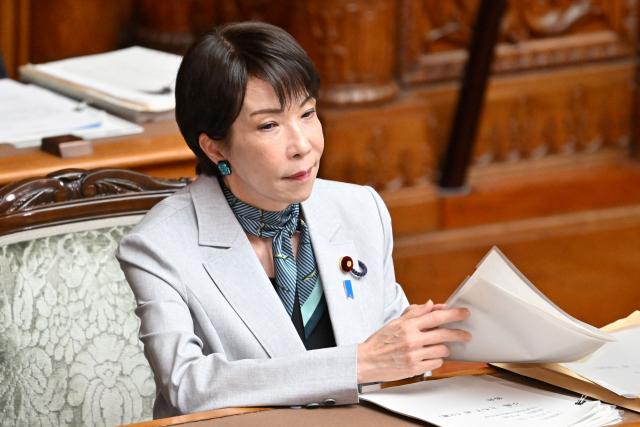 Japan's Prime Minister Sanae Takaichi listens to questions regarding the bill to establish the National Intelligence Council during a House of Councillors plenary session at the parliament in Tokyo on May 8, 2026. (Photo by Kazuhiro NOGI / AFP)