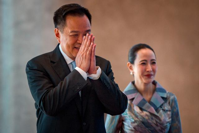 Thailand Prime Minister Anutin Charnvirakul and his wife Thananon Niramit arrive for a welcome ceremony during the 48th Association of Southeast Asian Nations (ASEAN) summit in Cebu, central Philippines on May 8, 2026. (Photo by Ezra Acayan / POOL / AFP)