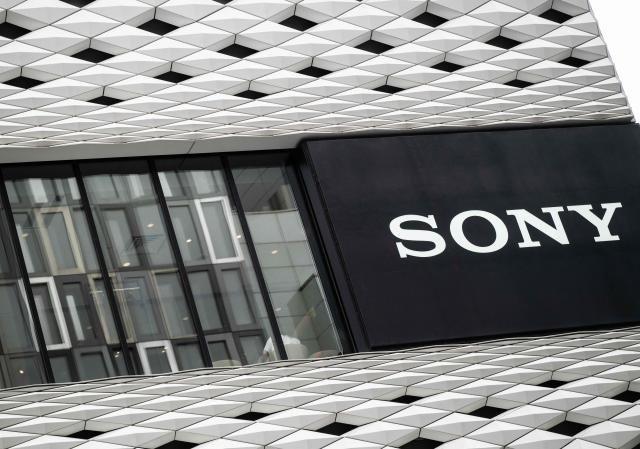 A Sony logo is seen on the side of a building next to a lounge in Tokyo on May 8, 2026. Japanese electronics giant Sony on May 8 forecast a 13 percent rise in net profit for the year to next March, boosted by its video games operations. (Photo by Andrew CABALLERO-REYNOLDS / AFP)