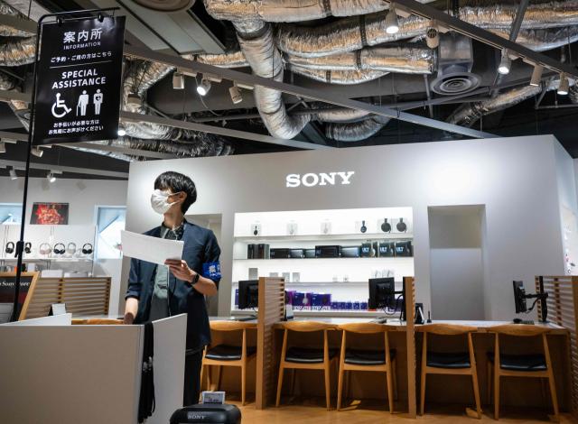 An employee is seen at a Sony showroom in Tokyo on May 8, 2026. Japanese electronics giant Sony on May 8 forecast a 13 percent rise in net profit for the year to next March, boosted by its video games operations. (Photo by Andrew CABALLERO-REYNOLDS / AFP)