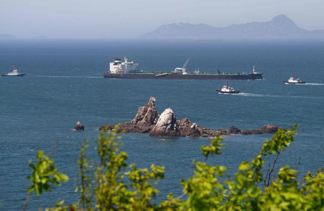 Malta-flagged oil tanker Odessa arrives near Daesan Port in Seosan City on May 8, 2026. An oil tanker that passed through the Strait of Hormuz arrived in South Korea on May 8, the first such vessel to reach the Asian nation by that route since Iran declared the critical waterway closed. (Photo by Shin Yong-ju / AFP)