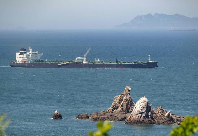 Malta-flagged oil tanker Odessa arrives near Daesan Port in Seosan City on May 8, 2026. An oil tanker that passed through the Strait of Hormuz arrived in South Korea on May 8, the first such vessel to reach the Asian nation by that route since Iran declared the critical waterway closed. (Photo by Shin Yong-ju / AFP)