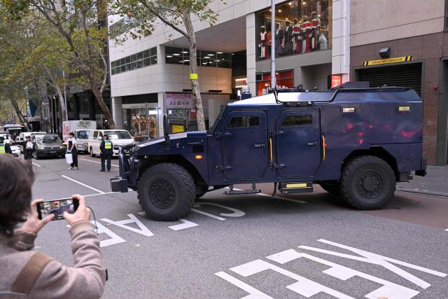 An armoured police vehicle transports two women linked to alleged Islamic State jihadists away from the Melbourne Magistrates Court in Melbourne on May 8, 2026, after their court appearance. Two Australian women "kept a female slave" after travelling to Syria in 2014 to support the Islamic State group, police said on May 8 after they were charged in Melbourne. The pair returned to Australia on the evening of May 7 for the first time in almost a decade, travelling from a Syrian detention camp where they were stranded after the group's collapse. (Photo by WILLIAM WEST / AFP)