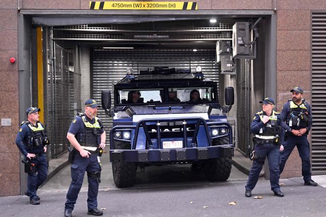 An armoured police vehicle arrives to transport two women linked to alleged Islamic State jihadists away from the Melbourne Magistrates Court in Melbourne on May 8, 2026, after their court appearance. Two Australian women "kept a female slave" after travelling to Syria in 2014 to support the Islamic State group, police said on May 8 after they were charged in Melbourne. The pair returned to Australia on the evening of May 7 for the first time in almost a decade, travelling from a Syrian detention camp where they were stranded after the group's collapse. (Photo by WILLIAM WEST / AFP)