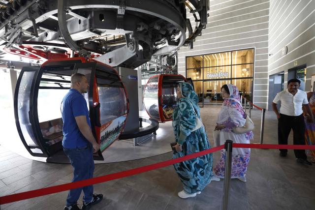 Visitors board the cable car to Agadir Oufella, on the heights of the coastal city of Agadir, on May 7, 2026. The Agadir cable car is a recent installation connecting the city of Agadir to the historical hill of Agadir Oufella, which is the location of an old fort much of which was affected by the earthquake that struck the city in 1960. (Photo by Abdel Majid BZIOUAT / AFP)