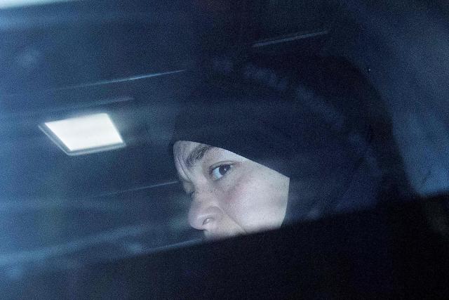 Zeinab Ahmad, one of two women linked to alleged Islamic State jihadists, is seen being taken away in an armoured police vehicle outside the Melbourne Magistrates Court in Melbourne on May 8, 2026, following her court appearance. Two Australian women "kept a female slave" after travelling to Syria in 2014 to support the Islamic State group, police said on May 8 after they were charged in Melbourne. The pair returned to Australia on the evening of May 7 for the first time in almost a decade, travelling from a Syrian detention camp where they were stranded after the group's collapse. (Photo by Martin KEEP / AFP)