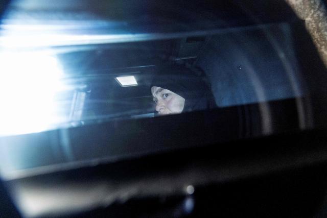 Zeinab Ahmad, one of two women linked to alleged Islamic State jihadists, is seen being taken away in an armoured police vehicle outside the Melbourne Magistrates Court in Melbourne on May 8, 2026, following her court appearance. Two Australian women "kept a female slave" after travelling to Syria in 2014 to support the Islamic State group, police said on May 8 after they were charged in Melbourne. The pair returned to Australia on the evening of May 7 for the first time in almost a decade, travelling from a Syrian detention camp where they were stranded after the group's collapse. (Photo by Martin KEEP / AFP)