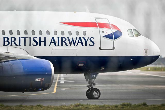 (FILES) A British Airways plane prepares to take off Gatwick airport, south London, on March 21, 2025. IAG, parent group of British Airways and Spanish carrier Iberia, said on May 8, 2026 that the Middle East war will lower its annual profits despite a strong start to 2026 (Photo by Glyn KIRK / AFP)