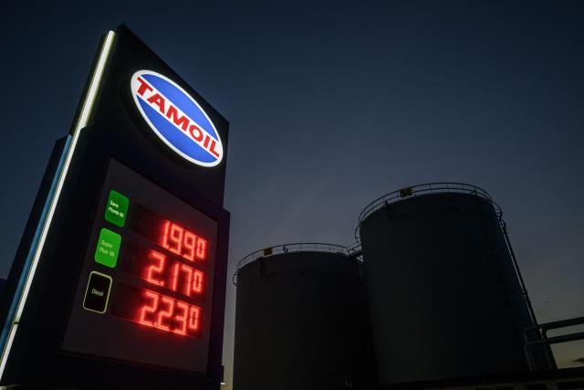 This photograph shows the prices per litre of petrol and diesel fuels at a Tamoil petrol station next to gasoline and fuel tanks in Geneva on May 8, 2026. Oil prices, which fell around 10 percent over the past three days, rose more than one percent on May 8, 2026 as US-Iran clashes in the Strait of Hormuz jolted hopes that the conflict will end soon. (Photo by Fabrice COFFRINI / AFP)