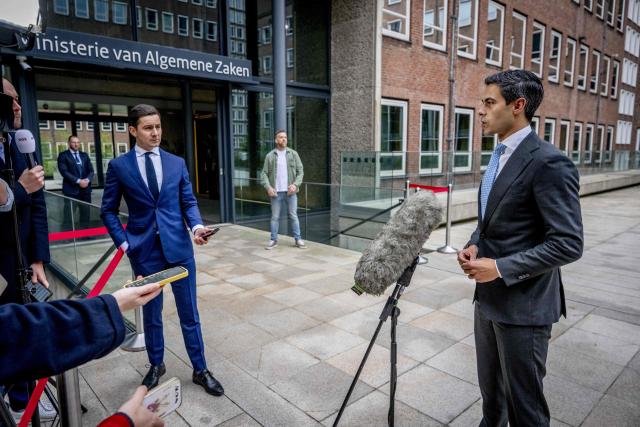 Dutch Prime Minister Rob Jetten (R) speaks to the press ahead of the first weekly cabinet meeting after the May recess at the Ministry of General Affairs in The Hague on May 8, 2026. Dutch Prime Minister Rob Jetten on May 7 hit out at a "cowardly act of intimidation" after the offices of his centrist D66 party in The Hague were attacked with a firework bomb. (Photo by Robin Utrecht / ANP / AFP) / Netherlands OUT