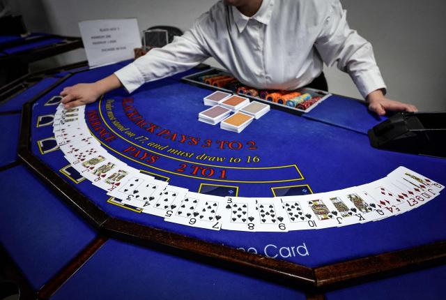 (FILES) An apprentice croupier attends a training session at the All'in Casino Experts school in Saint-Cloud on March 26, 2026. Freshly trained, 45 croupiers are eager to take to the floor: on May 12, 2026 in Paris, the Partouche Casino Club – the capital’s largest gaming club – is set to open a new four-storey, 5,000-square-metre gaming club near the Champs-Йlysйes avenue. (Photo by STEPHANE DE SAKUTIN / AFP)