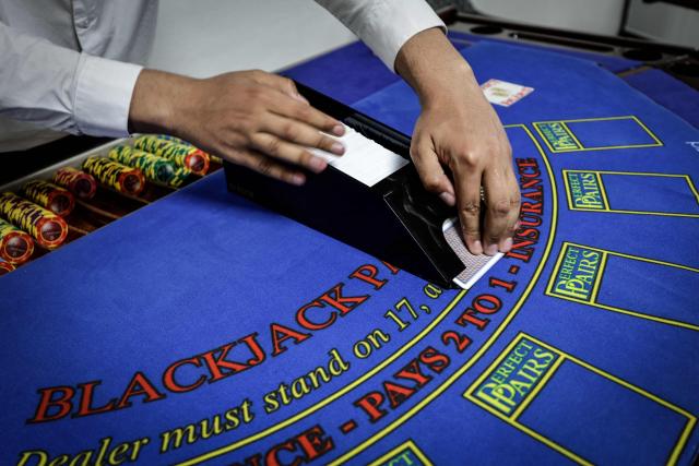 (FILES) An apprentice croupier attends a training session at the All'in Casino Experts school in Saint-Cloud on March 26, 2026. Freshly trained, 45 croupiers are eager to take to the floor: on May 12, 2026 in Paris, the Partouche Casino Club – the capital’s largest gaming club – is set to open a new four-storey, 5,000-square-metre gaming club near the Champs-Йlysйes avenue. (Photo by STEPHANE DE SAKUTIN / AFP)